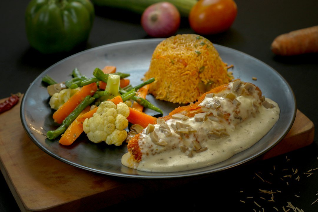 Creamy garlic chicken dinner in a skillet