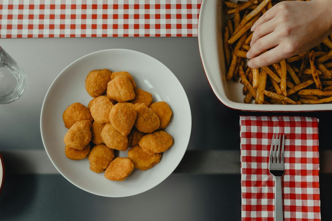 Crispy chicken nuggets arranged on a plate