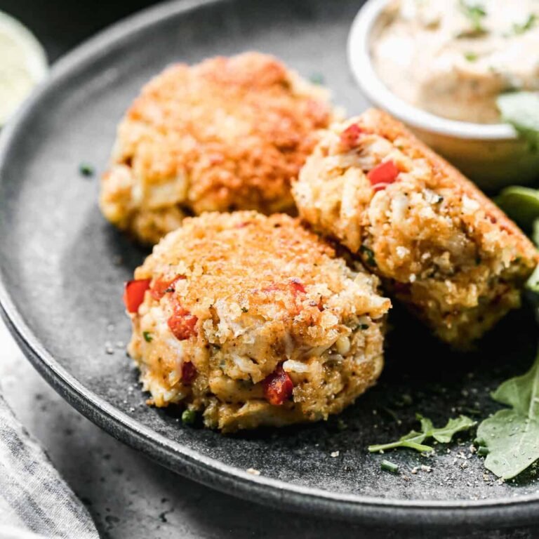 Golden homemade crab cakes with dipping sauce