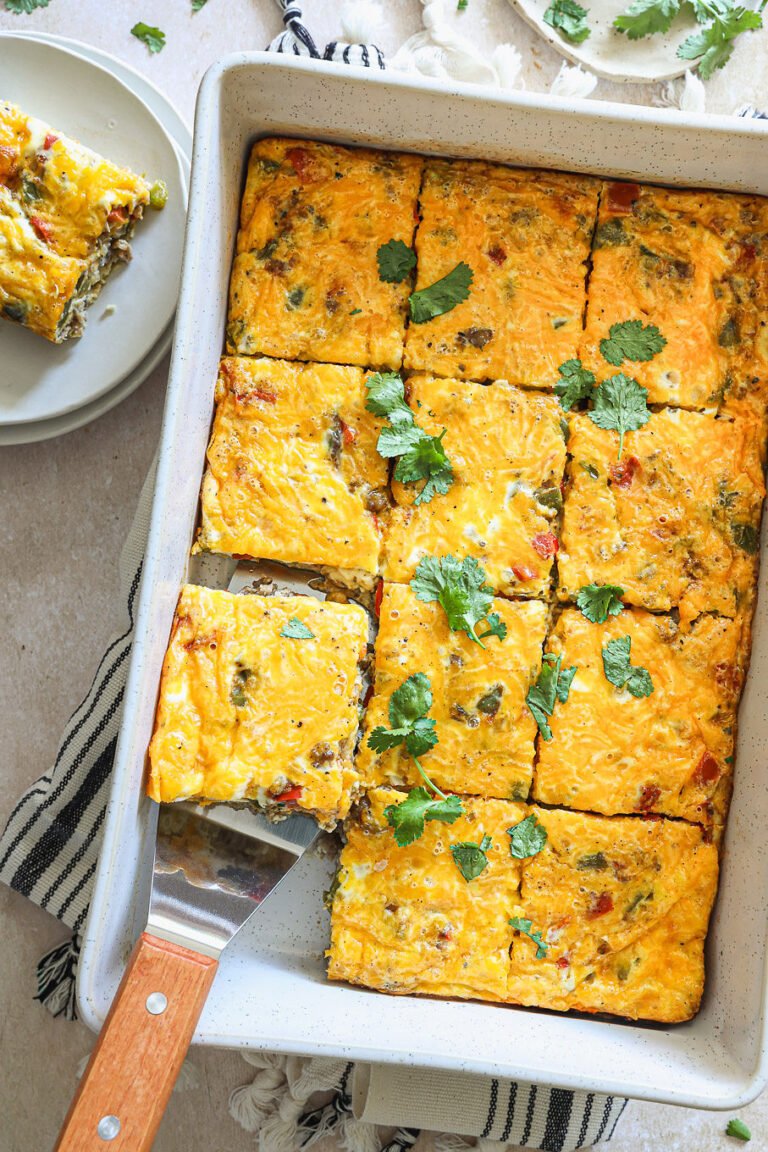 Southwest breakfast casserole with sausage, bell peppers, eggs, and melted cheese
