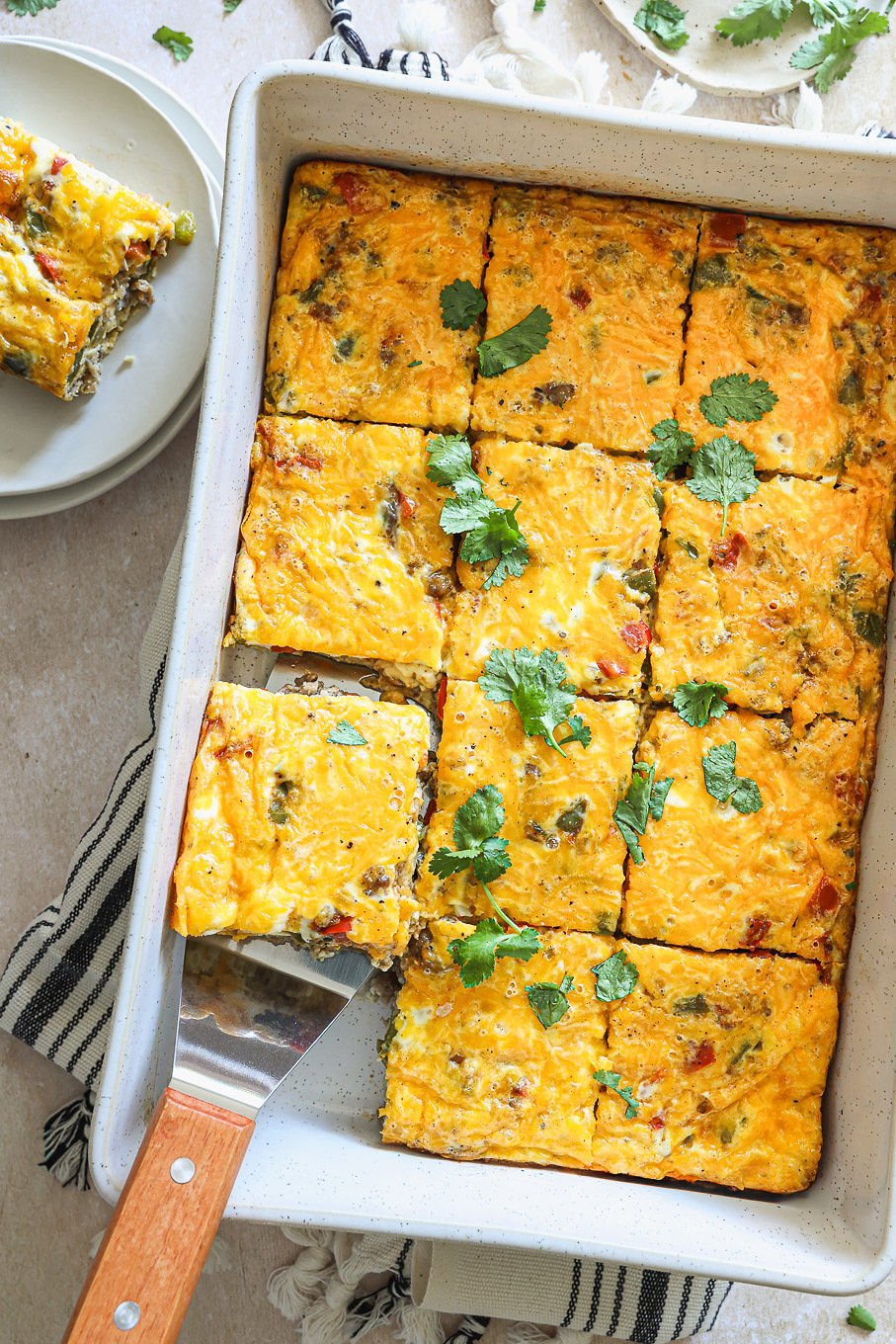 Southwest breakfast casserole with sausage, bell peppers, eggs, and melted cheese