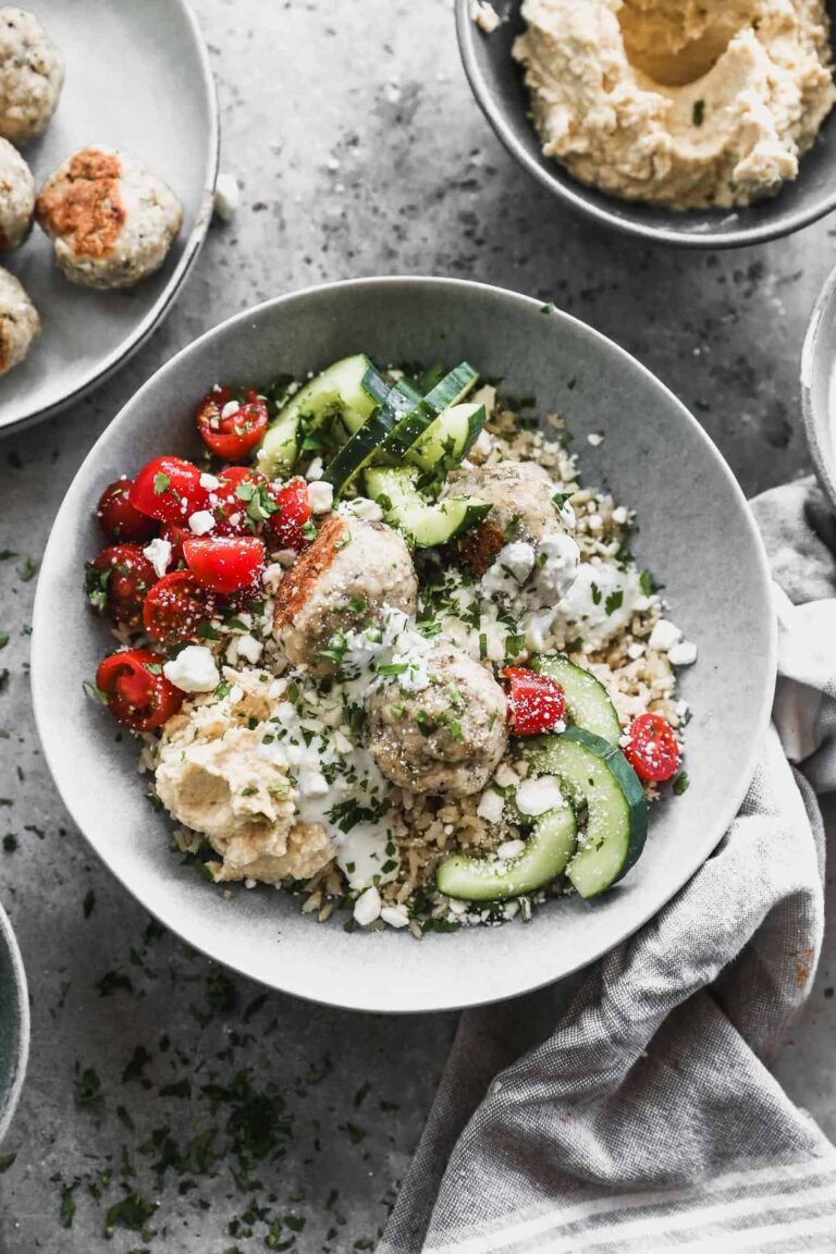 Mediterranean turkey meatball bowl with rice, vegetables, hummus, and tzatziki