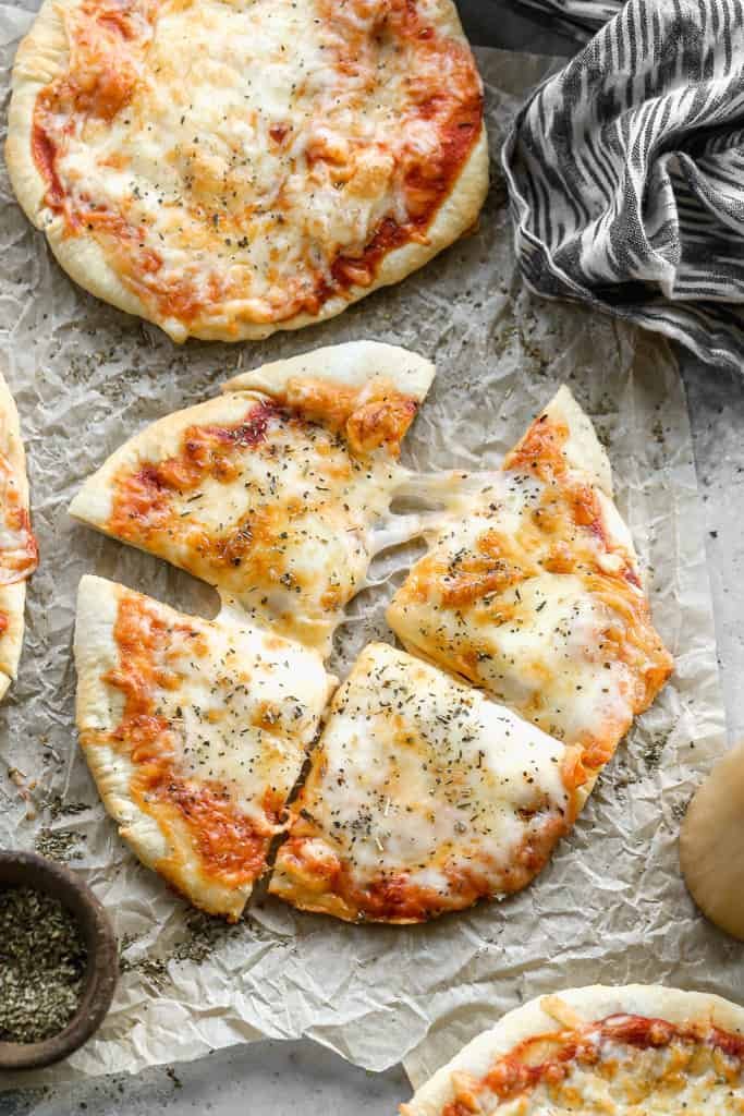 A freshly cooked air fryer pizza with melted cheese and toppings